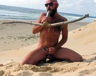 stud pulverizes himself on the beach with a wooden