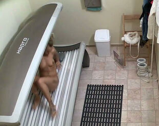 Young woman  czech doll bare in solarium and she doesn't