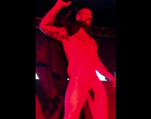 Bearded homo dancing Striptease at homo club