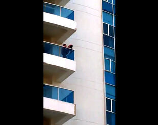 Hidden cam of duo on balcony